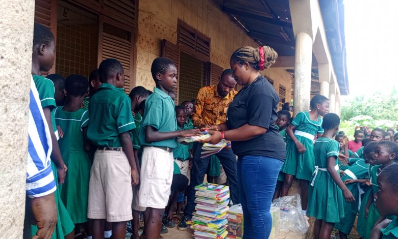 Former Student Donates Exercise Books to Pupils of Old Offinso RC Primary School